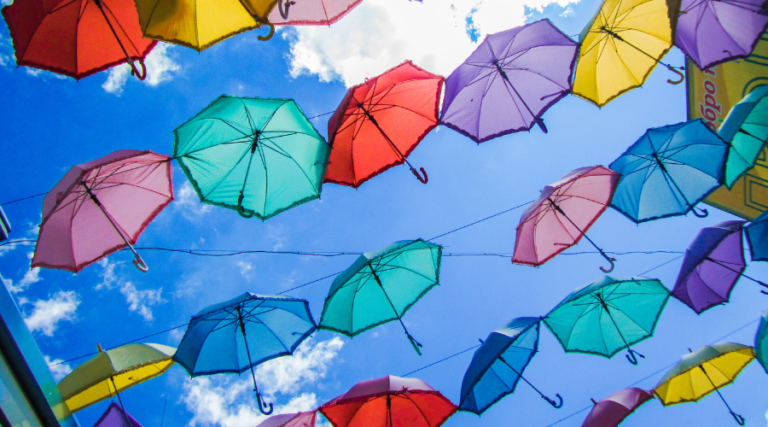 multicoloured umbrellas in the sky