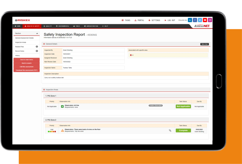 A tablet with a screenshot of the Safety Inspection software module in AssessNET.