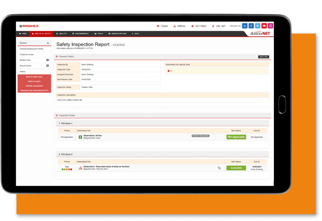 A tablet with a screenshot of the Safety Inspection software module in AssessNET.