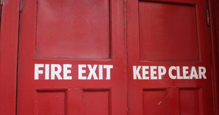 Red fire exit door up close