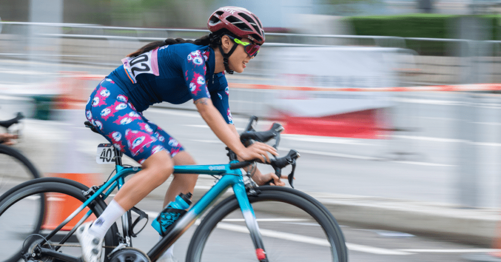 A cyclist riding at speed.