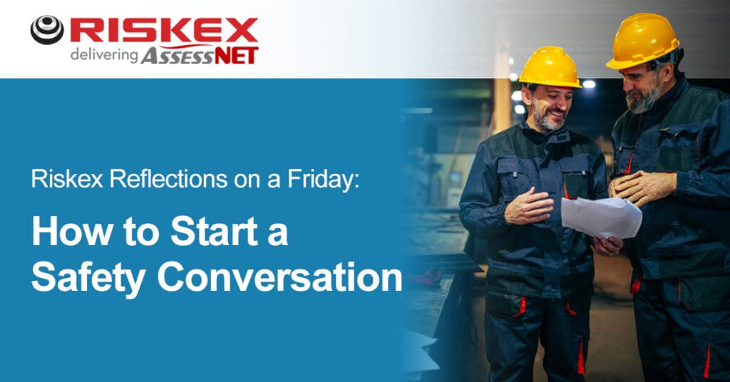 Two workers in hard hats having a conversation.