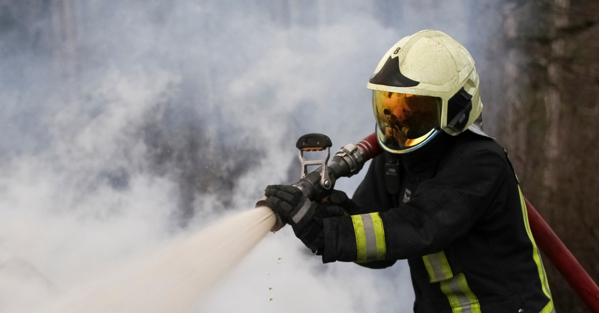 firefighter putting out fire.