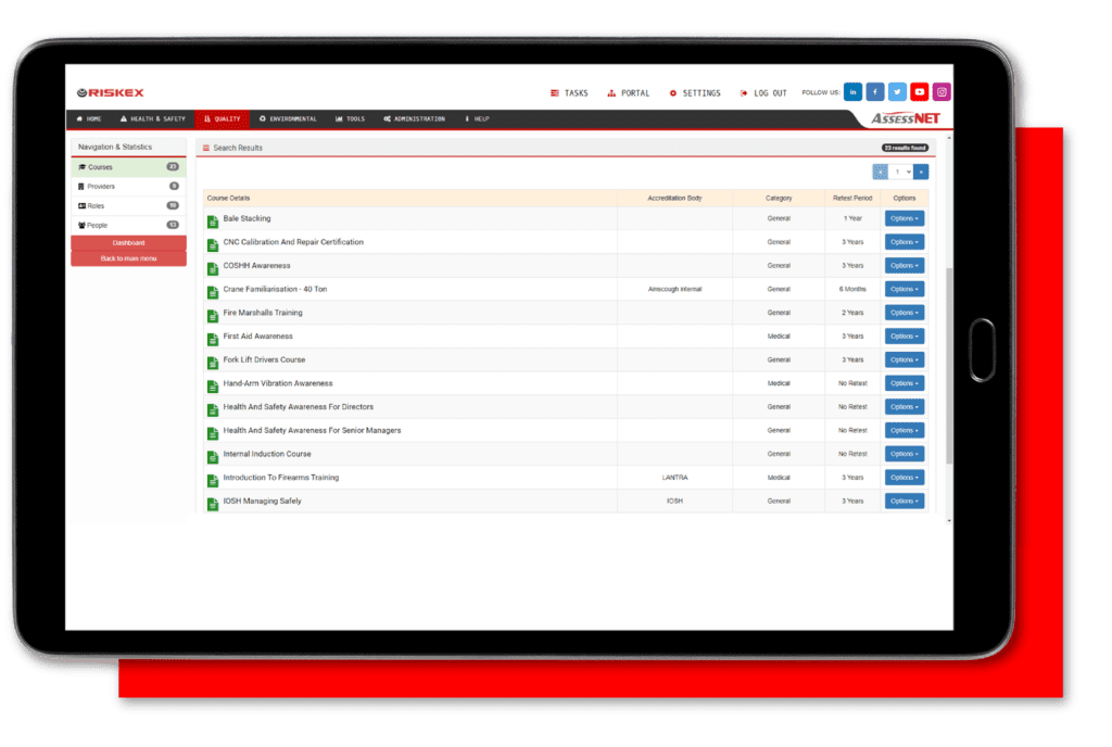 A tablet with a screenshot of the Training Management software module in AssessNET.