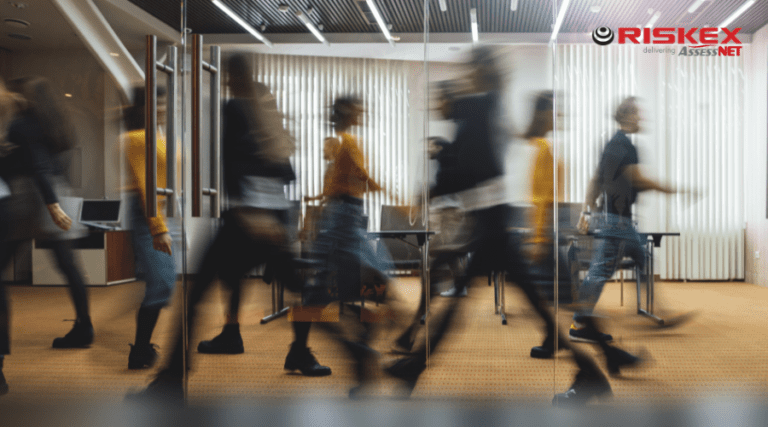employees walking back and forth in an office.