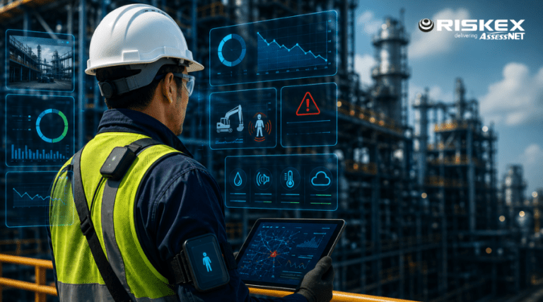 Industrial worker wearing smart PPE and using a digital tablet in a refinery environment, surrounded by real-time safety monitoring and predictive risk technology displays.
